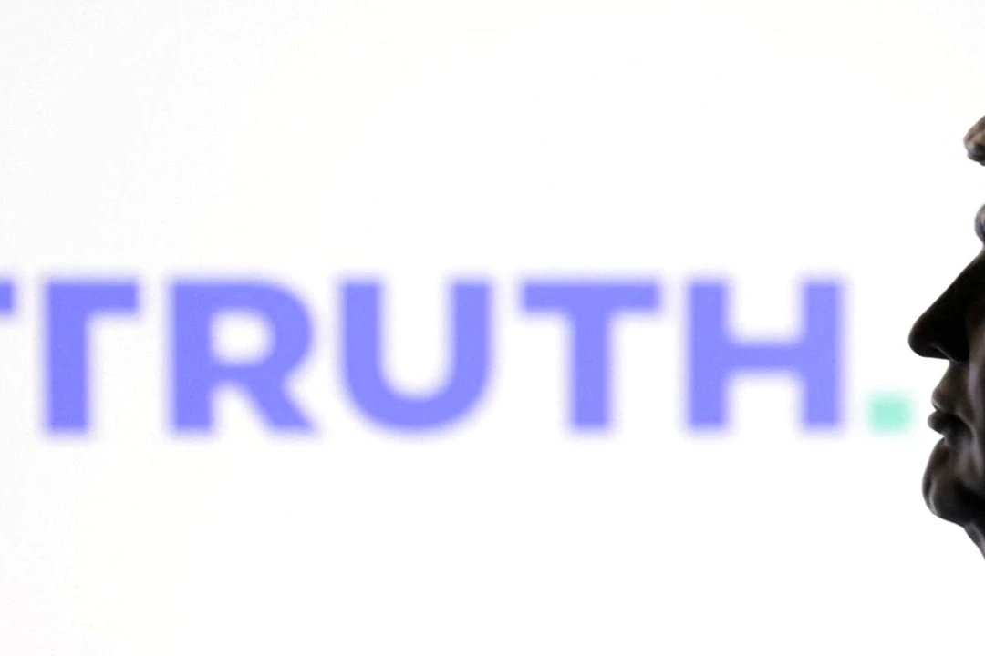 Logo de Truth Social sur un écran de smartphone, avec des graphiques boursiers rouges en arrière-plan